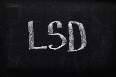 top view of black chalk board with lettering LSD clipart