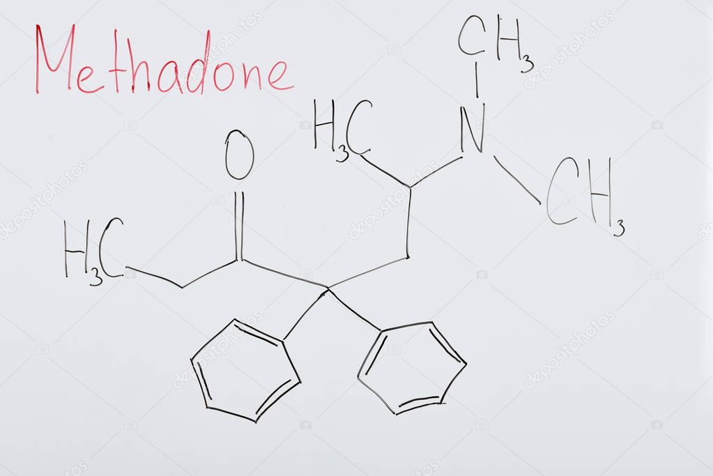 top view of white board with chemical formula and lettering methadone