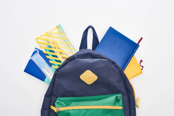 Blauwe Schooltas Met Verschillende Schoolbenodigdheden Geïsoleerd Wit — Stockfoto