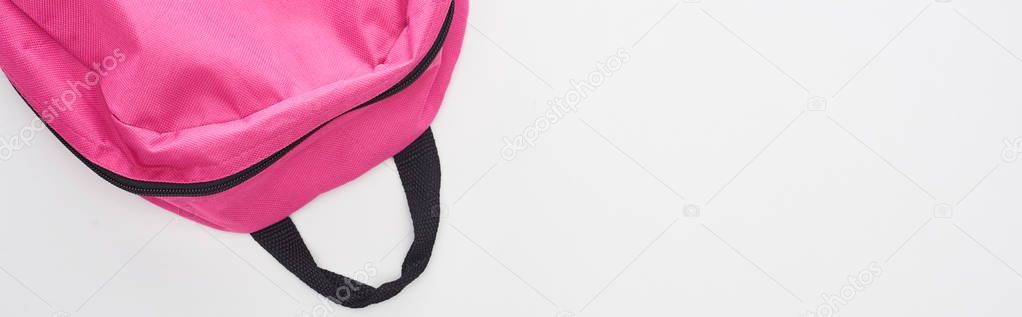 Panoramic shot of bright pink school bag isolated on white