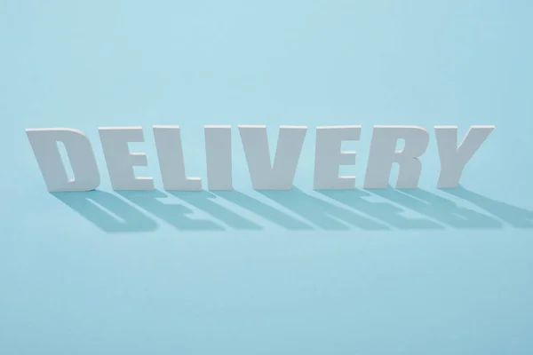 White Delivery Inscription Shadows Blue Background — Stock Photo, Image