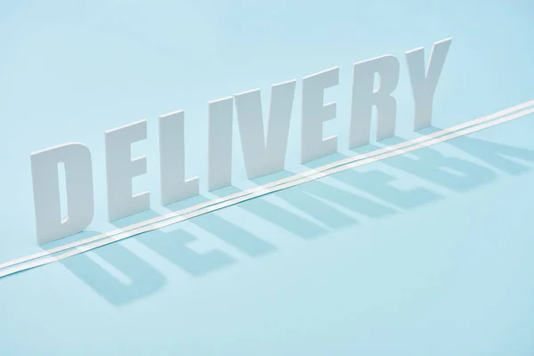 White Delivery Inscription Shadow Double Line Blue Background Copy Space — Stock Photo, Image