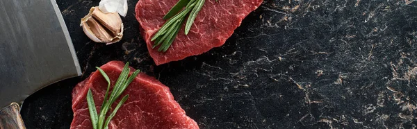 Panoramic Shot Unprocessed Beef Steaks Rosemary Sprigs Garlic Knife Black — Stock Photo, Image