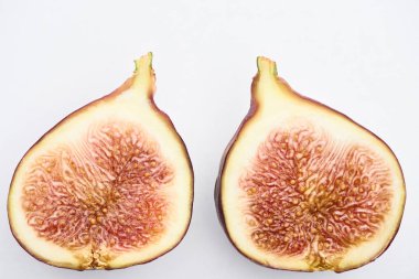 ripe delicious fig halves on white background clipart