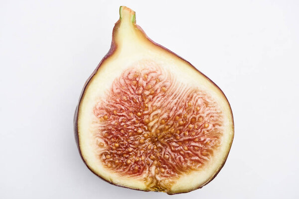 ripe delicious fig half on white background