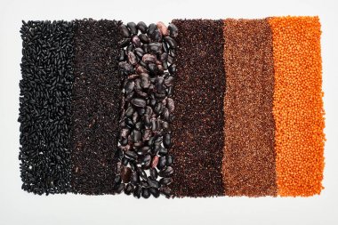 top view of assorted black beans, rice, quinoa, buckwheat and lentil isolated on white clipart
