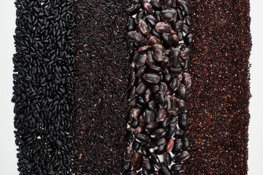 top view of assorted black beans, rice and quinoa isolated on white clipart