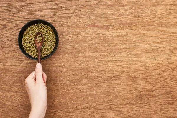 Cropped View Woman Holding Picking Spoon Raw Moong Beans Bowl — Stock Photo, Image