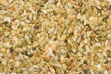top view of roasted organic pumpkin seeds clipart