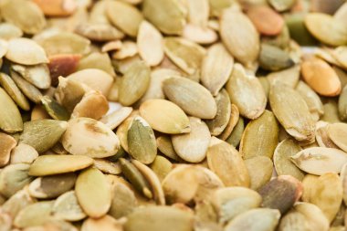 close up view of tasty roasted pumpkin seeds clipart