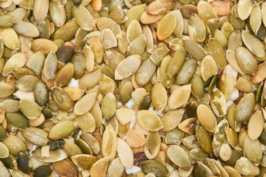 top view of tasty roasted organic pumpkin seeds clipart