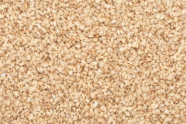 top view of uncooked pressed organic oats clipart
