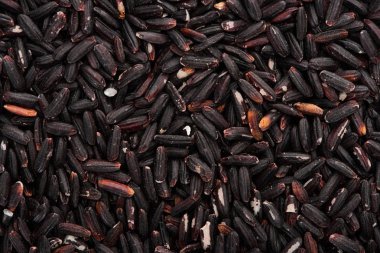 top view of uncooked organic black rice clipart