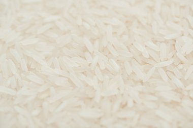 close up view of uncooked organic white rice clipart