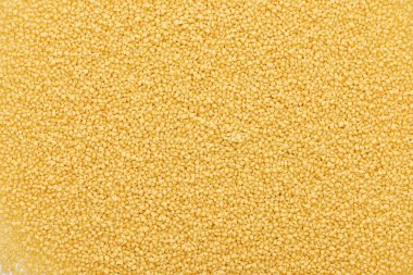 top view of uncooked organic couscous groat clipart