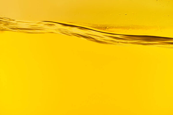 wavy clear fresh water on yellow background