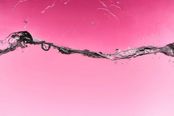 Welliges Süßwasser Auf Rosa Hintergrund Mit Tropfen Und Blasen — Stockfoto