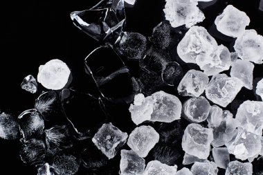 top view of fresh frozen ice cubes isolated on black clipart