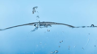 wavy transparent water on blue background with splash clipart