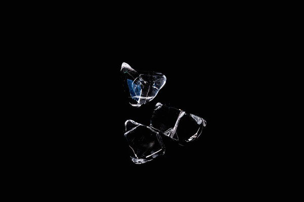 top view of transparent ice cubes isolated on black with copy space