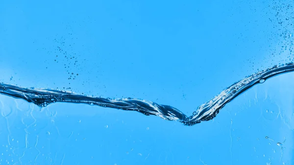 wavy water on blue background with droplets