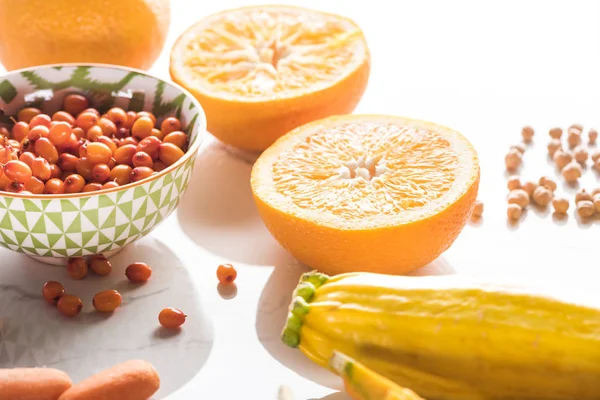 Orange Halves Bowl Berries Zucchini Marble Surface — Stock Photo, Image