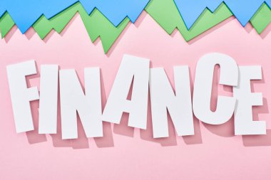 top view of finance inscription with green and blue statistic graphs on pink background clipart