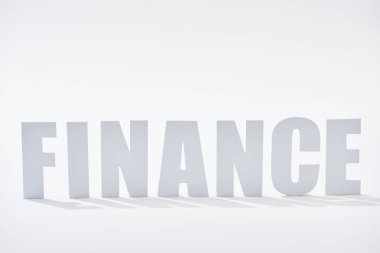beyaz arka plan üzerinde gölgeler ile finans kelime