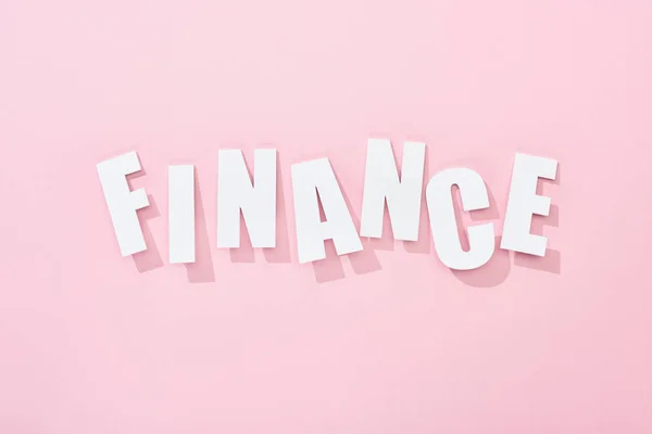 Top View White Finance Word Shadows Pink Background — Stock Photo, Image