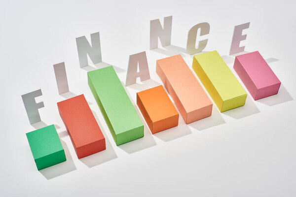 finance inscription near color block chart on white background