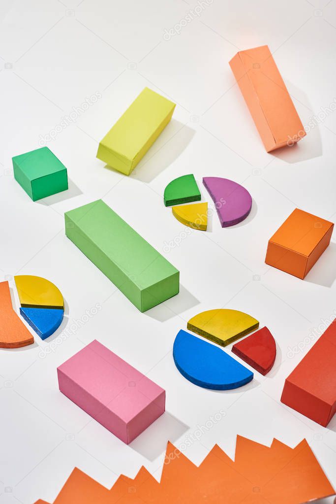 multicolor blocks and pie charts with shadow on white background