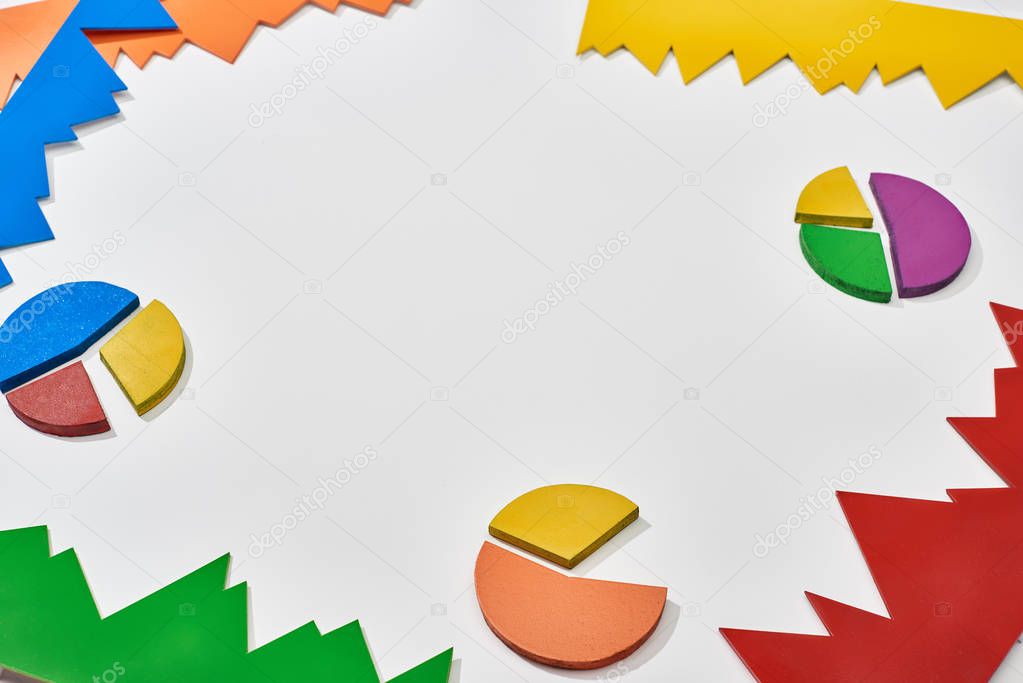 multicolor blocks and pie charts on white background with copy space