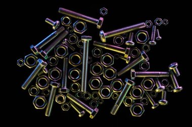 top view of scattered steel bolts and nuts isolated on black with copy space clipart
