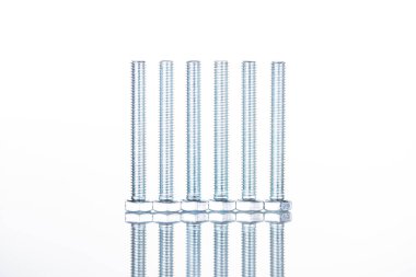 close up view of shiny long bolts isolated on white with copy space clipart