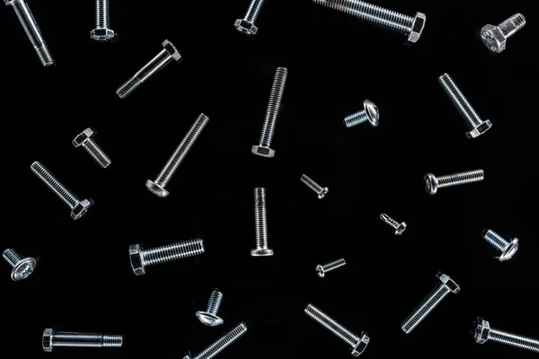 Top View Scattered Metal Bolts Pattern Isolated Black — Stock Photo, Image