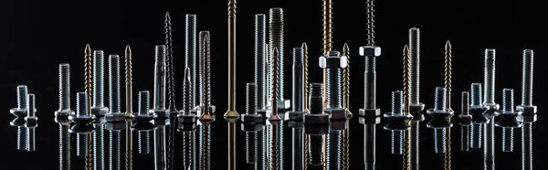 panoramic shot of diverse spotless metallic screws isolated on black