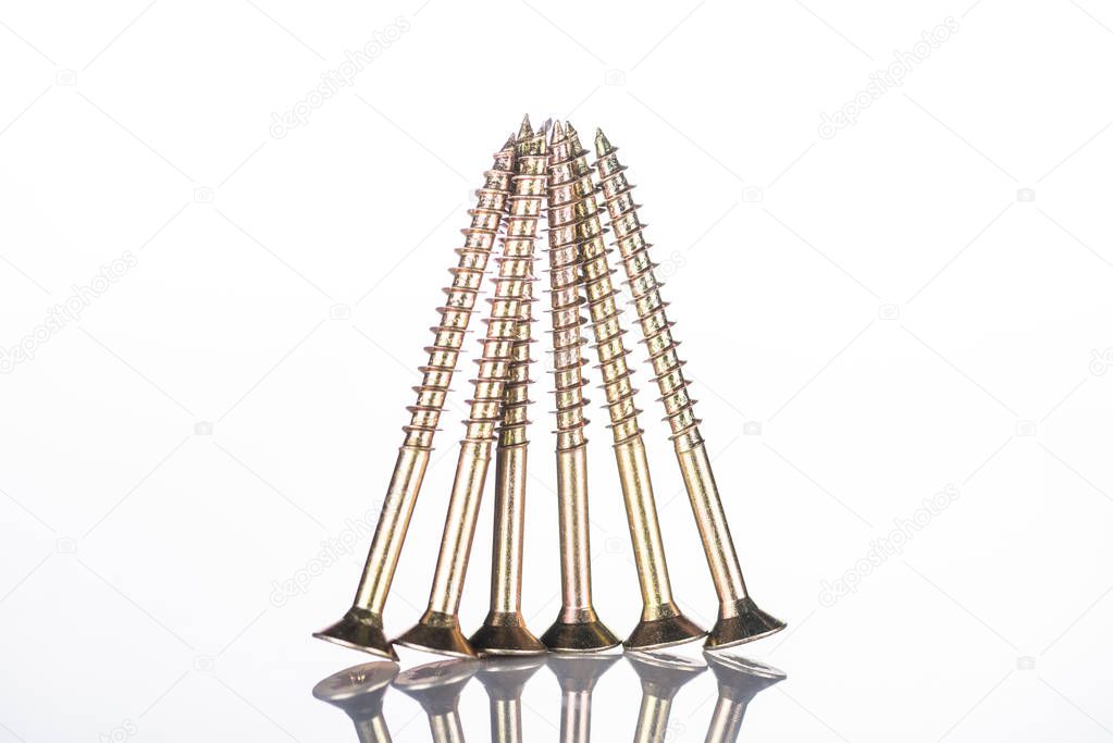 shiny spotless metal studs isolated on white with copy space