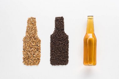 top view of bottle of light beer near wheat and coffee grains isolated on white clipart
