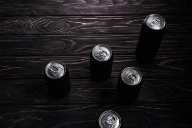 aluminum cans of beer on wooden table with copy space clipart