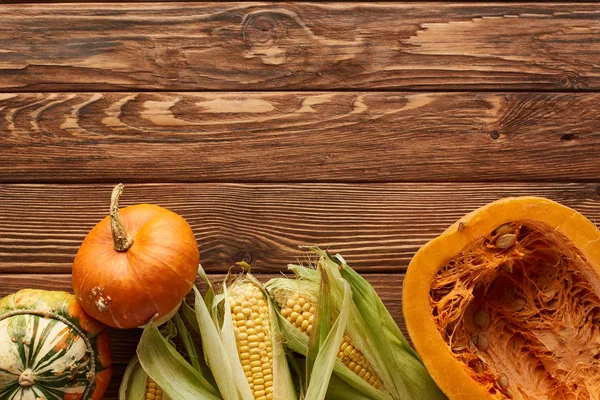 Top View Raw Sweet Corn Whole Pumpkin Half Brown Wooden — Stock Photo, Image