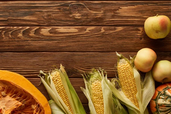 Top View Raw Sweet Corn Pumpkin Half Apples Brown Wooden — Stock Photo, Image