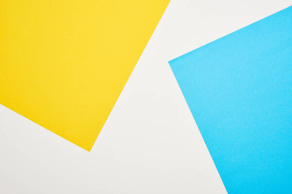 top view of geometric blue, yellow and white background