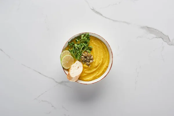 Top view of tasty mashed pumpkin soup on marble surface — Stock Image Top View Tasty Mashed Pumpkin Soup Marble Surface Royalty Free Stock Images