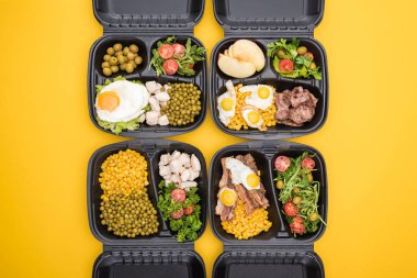 top view of eco packages with apples, vegetables, meat, fried eggs and salads isolated on yellow  clipart