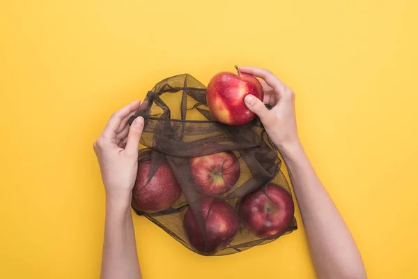 Partial View Woman Holding Eco Bag Ripe Apples Isolated Yellow — Stock Photo, Image