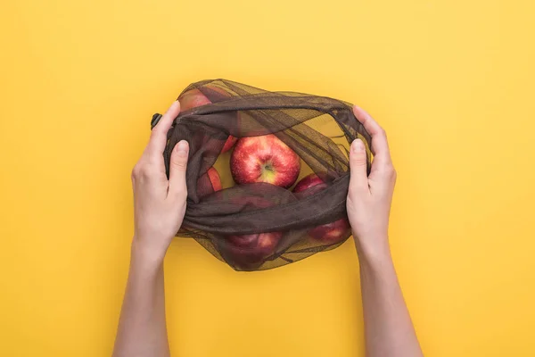 Partial View Woman Holding Eco Bag Ripe Apples Isolated Yellow — Stock Photo, Image