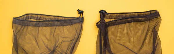 Top View Black Mesh Empty Bag Isolated Yellow Panoramic Shot — Stock Photo, Image