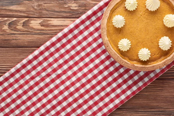 Top View Delicious Pumpkin Pie Whipped Cream Checkered Napkin Brown — Stock Photo, Image
