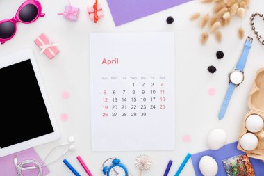 april calendar page, digital tablet, sunglasses, pastry sprinkles, chicken eggs, blackberry, spikelets, wristwatch, toy alarm clock, earphones isolated on white clipart