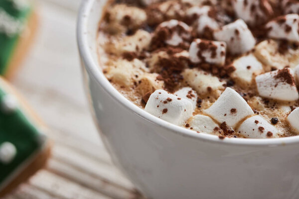 close up view of cacao with marshmallow in mug